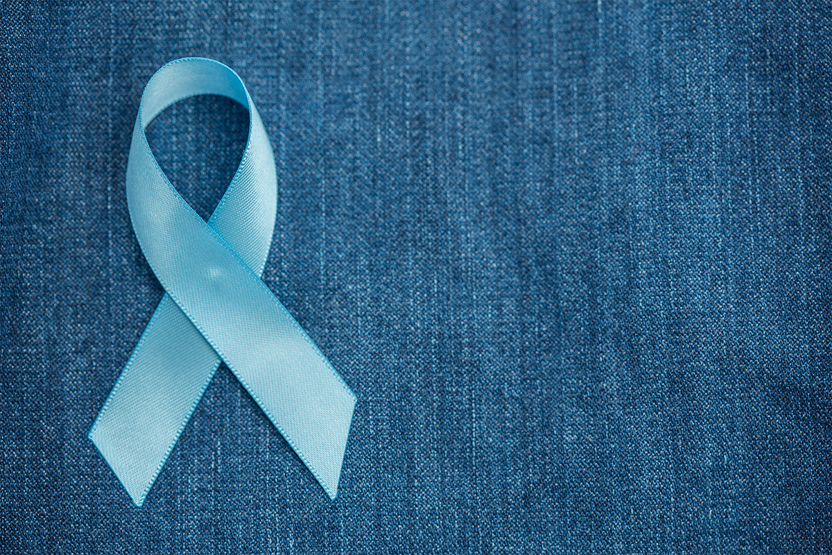 blue prostate cancer ribbon on denim background